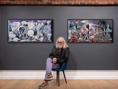 Ron English sits in front of Punk Skunk Guernica and ‘Star Wars Guernica (Castle Fine Art/PA)