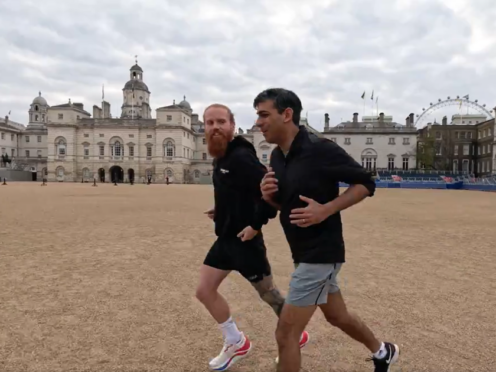 Ultra-runner Russ Cook and Prime Minister Rishi Sunak run past London’s landmarks (Rishi Sunak/PA)