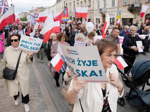 Anti-abortion demonstrators march in Warsaw (Czarek Sokolowski/AP)