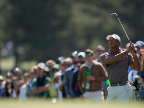 Tiger Woods watches his chip on the 18th hole during the second round of the Masters (Ashley Landis/AP)