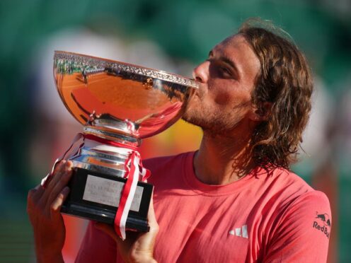 Stefanos Tsitsipas with the trophy after his Monte-Carlo Masters final victory over Casper Ruud (Daniel Cole/AP)