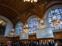 Judges enter the International Court of Justice (Peter Dejong/AP)