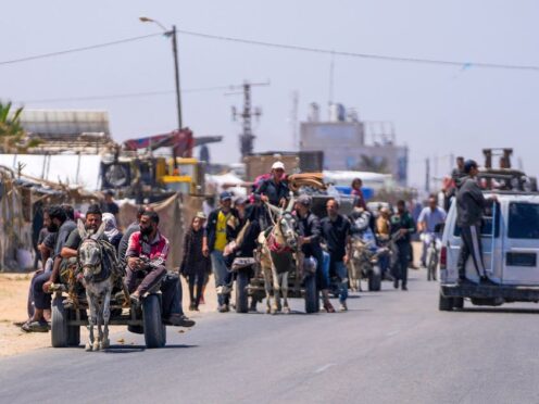 Displaced Palestinians arrive in central Gaza after fleeing from the southern Gaza city of Rafah (Abdel Kareem Hana/AP)