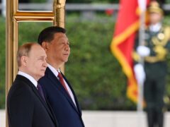 Chinese President Xi Jinping and Russian President Vladimir Putin attend an official welcome ceremony in Beijing (Sergei Bobylev, Sputnik, Kremlin Pool Photo via AP)
