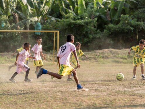 Boys playing football as part of a local sports club near Orihueca, Magdalena, Colombia (Chris Terry/Fairtrade/PA)