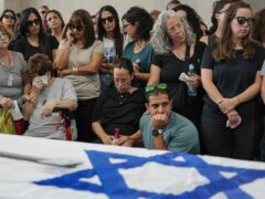Mourners attend the funeral of Michel Nisenbaum, who was killed during Hamas’s October 7 attack and whose body was recovered from Gaza last week (Tsafrir Abayov/AP)