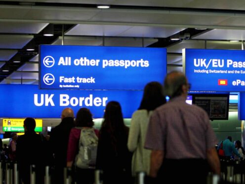 The total number of visas issued to people coming to the UK has fallen slightly (Steve Parsons/PA)