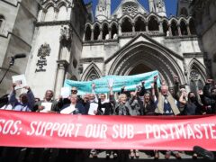 Former post office workers outside the Royal Courts of Justice in 2021 (PA)