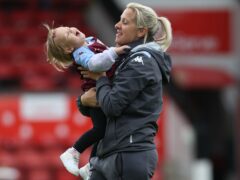 Aston Villa manager Carla Ward with her daughter on the pitch (Barrington Coombs/PA)