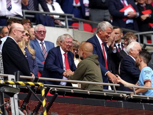 Sir Alex Ferguson greets Manchester City manager Pep Guardiola (Nick Potts/PA)