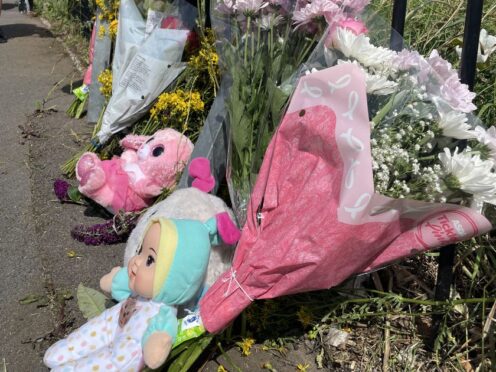 Flowers left at the scene of the fatal collision in Turnstone Road, Walsall, in July 2023. (Phil Barnett/PA)
