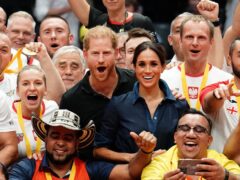 The Duke and Duchess of Sussex with medal winners at the sitting volleyball final at the Invictus Games in Dusseldorf, Germany (Jordan Pettitt/PA)