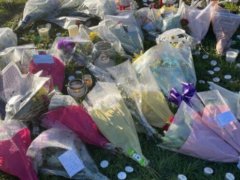 Floral tributes left at the scene at playing fields in Wolverhampton where Shawn Seesahai died (Matthew Cooper/PA)
