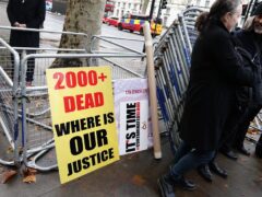 Campaigners outside Downing Street, central London after a letter was handed into Number 10 calling for the Government to speed up compensation for victims of the infected blood scandal (Aaron Chown/PA)
