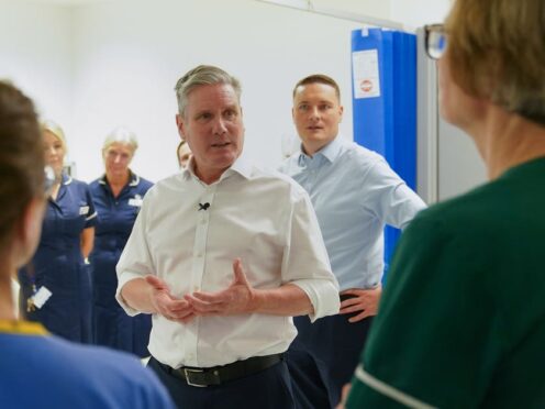 Labour leader Sir Keir Starmer and shadow health secretary Wes Streeting meet staff during a visit to the theatre recovery ward in the Bexley Wing of St James’ University Hospital in Leeds (Joe Giddens/PA)