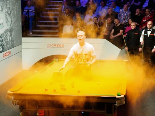 Just Stop Oil protester Eddie Whittingham jumped on the table at the 2023 World Snooker Championship (Mike Egerton/PA)