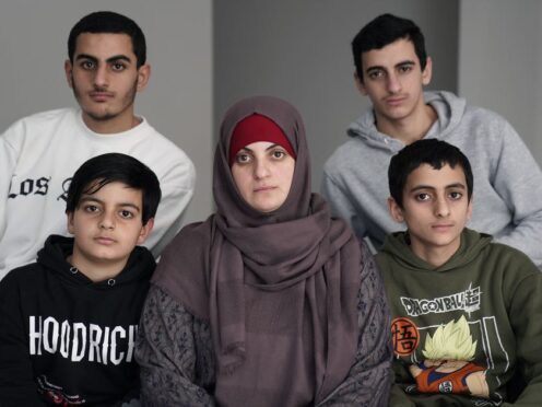 Zak Hania’s wife Batoul Hania and sons Nourmohammed, 11, (front left), Ahmed, 14, (front right), Mazen, 19, (back left) and Ismael, 17, (back right) (Brian Lawless/PA)