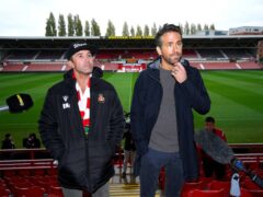 Wrexham owners Rob Elhenney (left) and Ryan Reynolds have ambitious plans to develop the ground so “the whole town could come to a game” (Peter Byrne/PA)