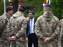 Rishi Sunak speaks with British troops in April (PA)