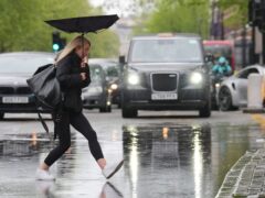 Poor weather held consumer spending back last month, as fewer people hit the high street (Jonathan Brady/PA Wire)
