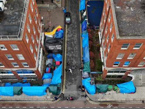 Migrants who were living outside the Office of International Protection have been moved (Niall Carson/PA)