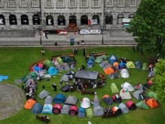 Students taking part in an encampment protest over the Gaza conflict on the grounds of Trinity College in Dublin (PA)