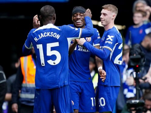 Noni Madueke (centre) is congratulated by Cole Palmer (right) after he set up Chelsea’s fourth goal for Nicolas Jackson (left) on Sunday (Zac Goodwin/PA)