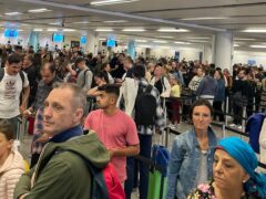Delays at passport control (Paul Curievici/AP)