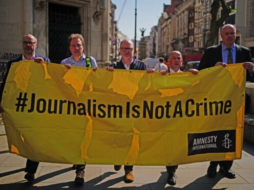 Supporters of journalists Barry McCaffrey and Trevor Birney, outside the Royal Courts of Justice in London, before their Investigatory Powers Tribunal (PA)