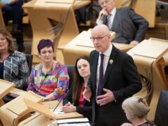 John Swinney has faced his first session of First Minster’s Questions since taking on the top job (Lesley Martin/PA)
