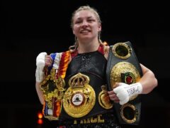 Lauren Price celebrates with belts following the IBA and WBA world Welterweight victory over Jessica McCaskill (Bradley Collyer/PA)