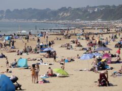 People enjoying the sunny weather on Bournemouth Beach in Dorset (Andrew Matthews/PA)