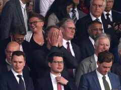 Sir Jim Ratcliffe holds his head in his hands in front of Sir Keir Starmer in the Old Trafford directors’ box (Martin Rickett/PA)