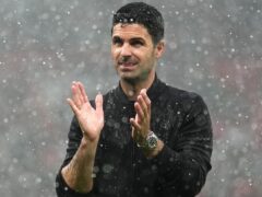 Arsenal manager Mikel Arteta applauds the club’s fans at a soggy Old Trafford (Martin Rickett/PA)