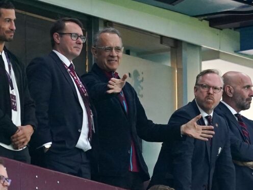 Actor Tom Hanks watches from the stands during the Premier League match at Villa Park (Martin Rickett/PA)