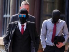 Defendants Daniel Graham, left, and Adam Carruthers, right, wore masks outside court (Owen Humphreys/PA)