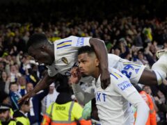 Leeds United’s Georginio Rutter celebrates with team-mate Wilfried Gnonto (top) after scoring their side’s third goal of the game during the Sky Bet Championship play-off semi-final second leg match at Elland Road, Leeds. Picture date: Thursday May 16, 2024.