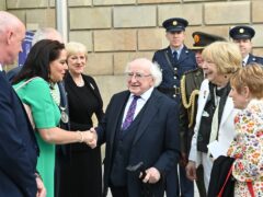 President of Ireland Michael D Higgins (centre) during a wreath-laying ceremony at the Memorial to the victims of the Dublin and Monaghan bombings (Oliver McVeigh/PA)