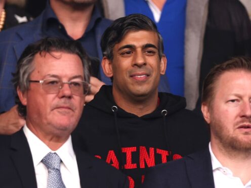 Prime Minister of the United Kingdom Rishi Sunak (centre) during the Sky Bet Championship play-off, semi-final, second leg match at St Mary’s Stadium, Southampton (Steven Paston/AP)