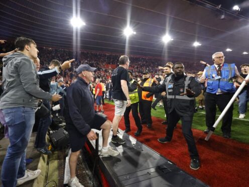 Police and ground staff attempt to separate the Southampton fans from West Brom away stand (Steven Paston/PA)