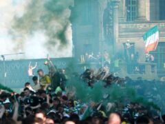 Celtic fans celebrate in Glasgow city centre (Andrew Milligan/PA)