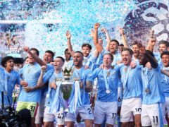 Manchester City lifted the Premier League trophy for a fourth straight season (Martin Rickett/PA)