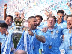 Manchester City’s Kyle Walker lifts the Premier League trophy (Martin Rickett/PA)