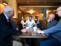 Prime Minister Rishi Sunak in his constituency in Northallerton meets veterans (clockwise from l to r) Douglas and wife Vicky Rudd, Mike Crisp and Michael Lloyd (Oli Scarff/PA)