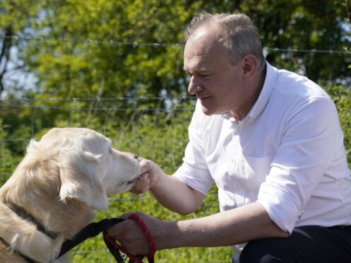 Liberal Democrat leader Sir Ed Davey went on a dog walk with supporters near Winchester (Andrew Matthews/PA)
