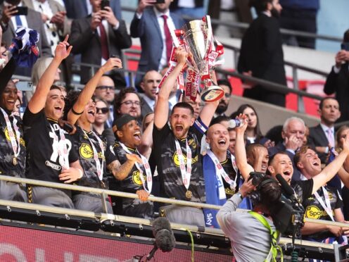 Southampton’s Jack Stephens lifts the trophy after their victory at Wembley (Adam Davy/PA).