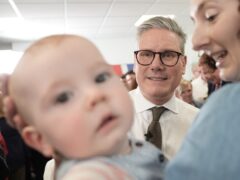 Labour Party leader Sir Keir Starmer held two separate events in Worcester during the first week of the election campaign, including meeting a camera-friendly baby at Worcester City football club (Stefan Rousseau/PA)