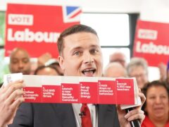 Shadow health secretary Wes Streeting with a booklet containing Labour six General Election pledges (Stefan Rousseau/PA)