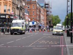 Police at the scene of the shooting in Kingsland High Street, Hackney, east London (James Manning/PA)