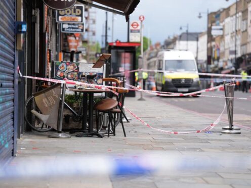 Police at the scene of a shooting at Kingsland High Street, Hackney, east London (James Manning/PA)